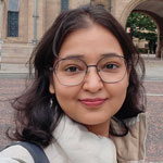 Woman standing in front of a University building